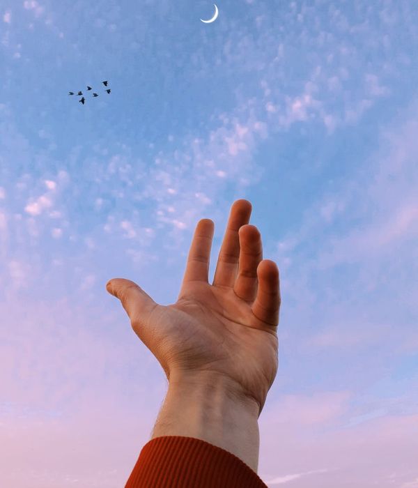 A silhouette of a person feeling balanced and energetic against a calm background.